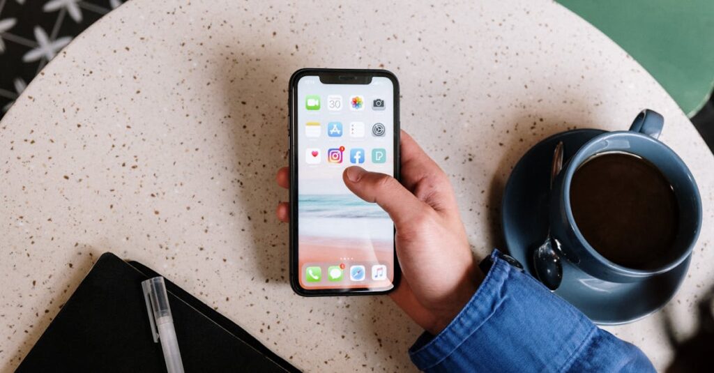 Person interacts with smartphone and coffee on a terrazzo table, showcasing apps and casual lifestyle.